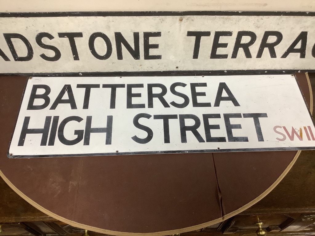 Two street signs, Gladstone Terrace SW8 and Battersea High Street